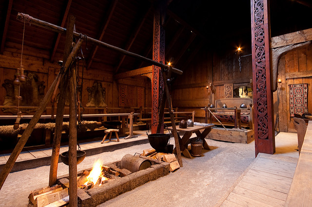 Interior of a Viking longhouse, with decorative wooden columns